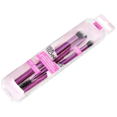Real Techniques makeup brush set in packaging, featuring blending, foundation, and eye shadow brushes.
