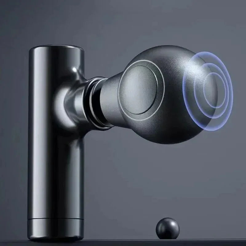 Close-up of a portable electric muscle massage gun with a spherical attachment for deep tissue massage.
