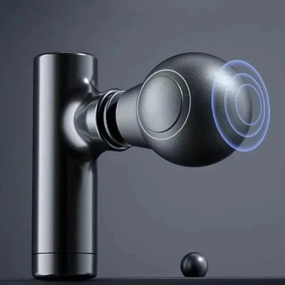 Close-up of a portable electric muscle massage gun with a spherical attachment for deep tissue massage.